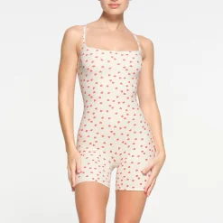 FITS EVERYBODY PICOT TRIM ONESIE | RUBY HEART PRINT