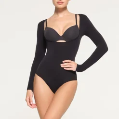 SEAMLESS SCULPT LONG SLEEVE OPEN BUST BRIEF BODYSUIT | ONYX