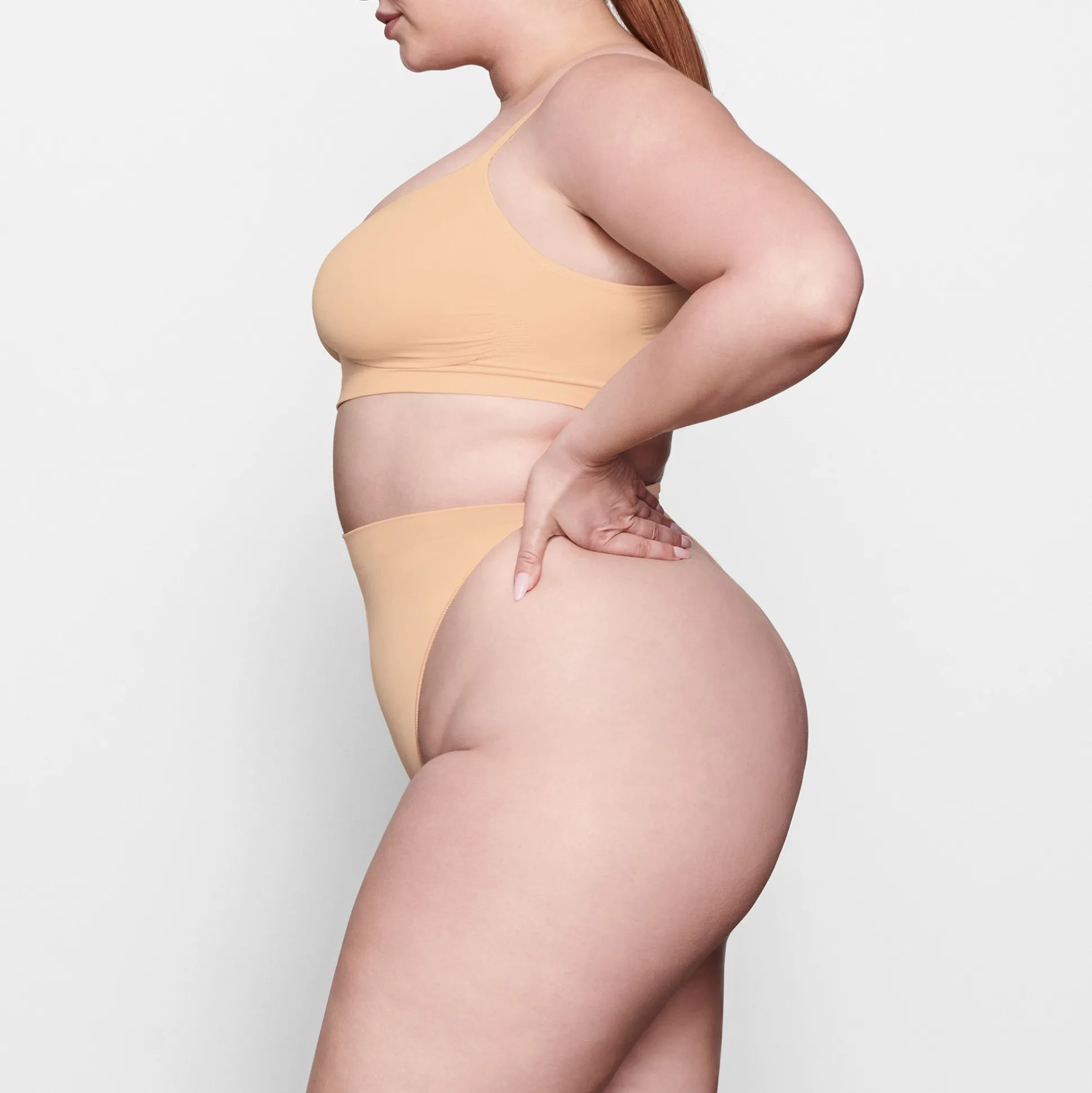 SEAMLESS SCULPT MID WAIST THONG | OCHRE