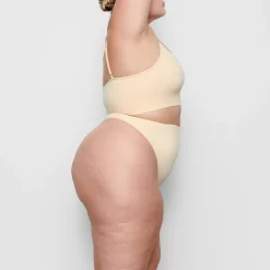 SEAMLESS SCULPT MID WAIST THONG | SAND