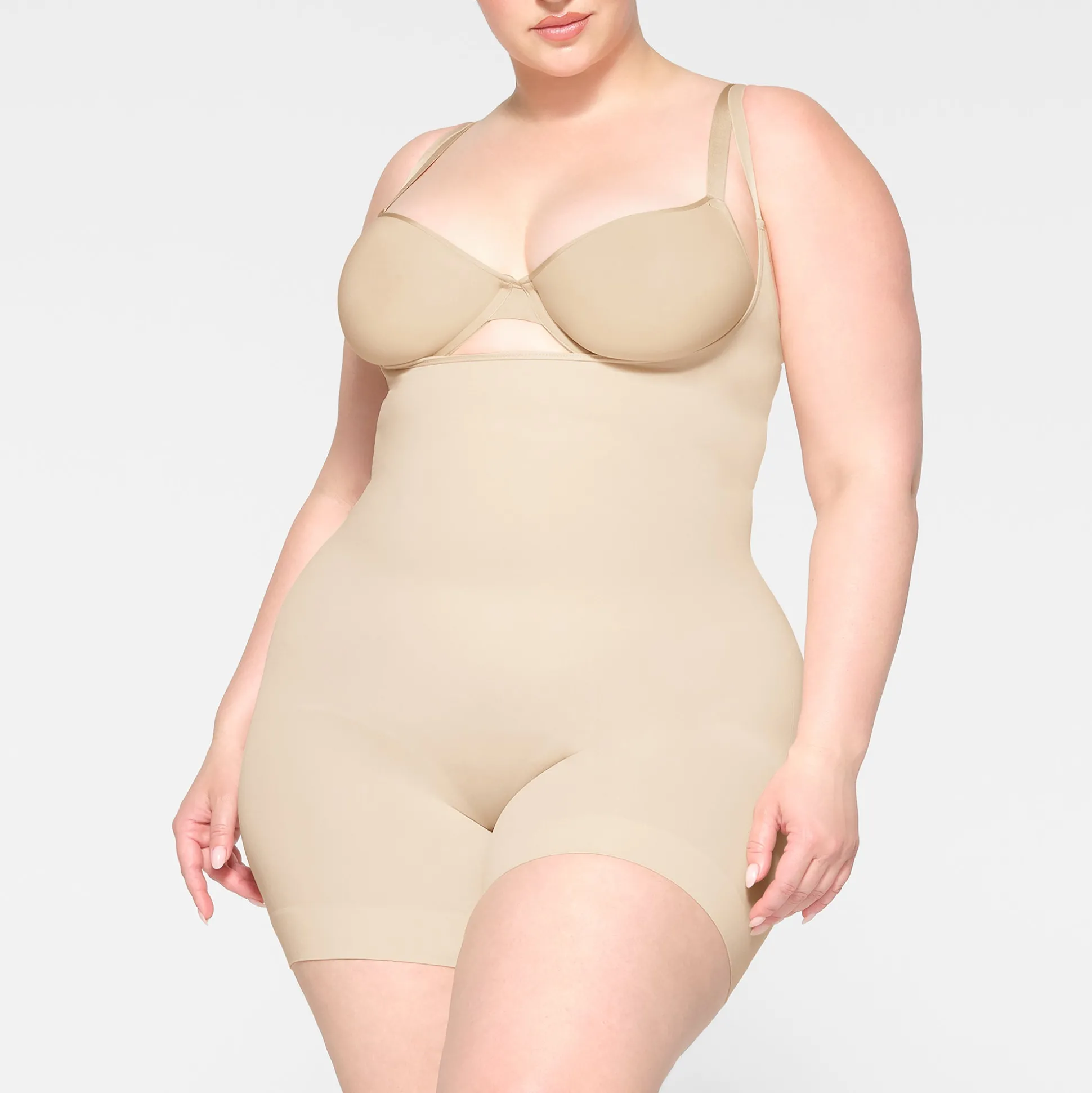 SEAMLESS SCULPT OPEN BUST SHORTIE BODYSUIT | SAND