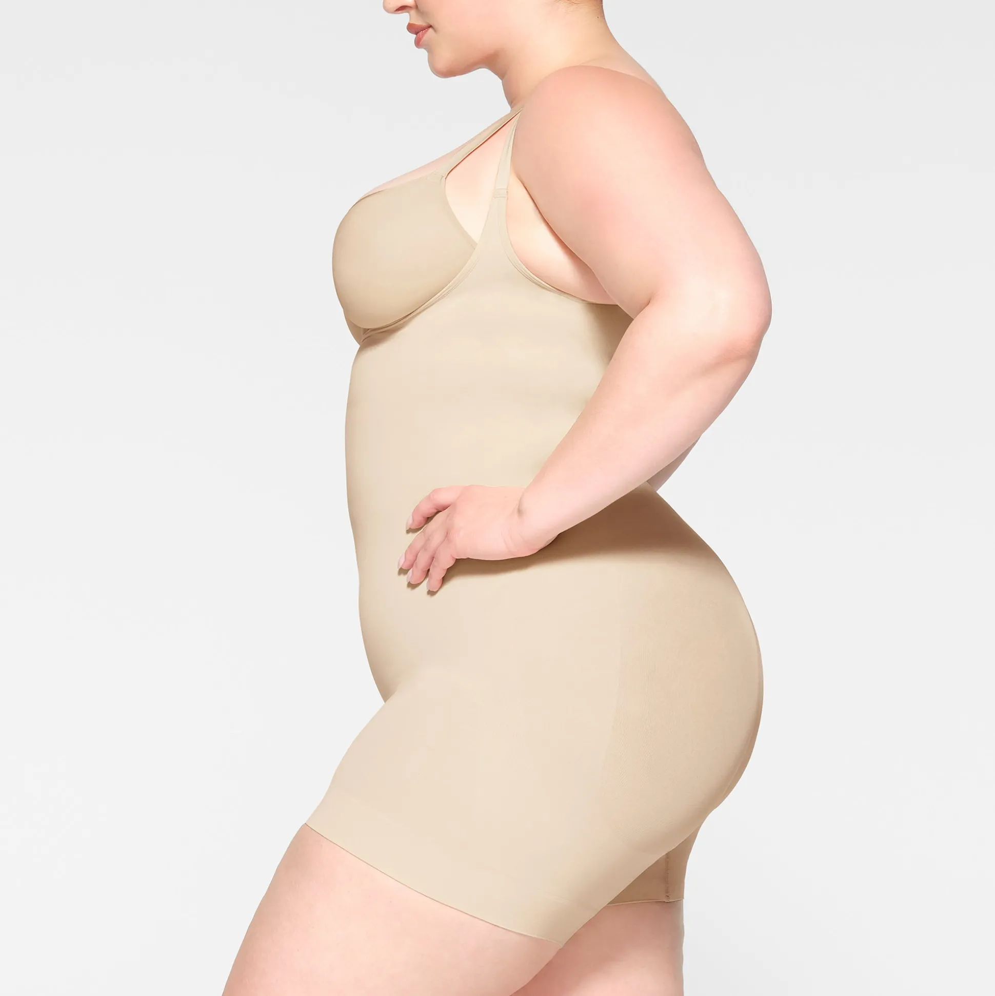SEAMLESS SCULPT OPEN BUST SHORTIE BODYSUIT | SAND