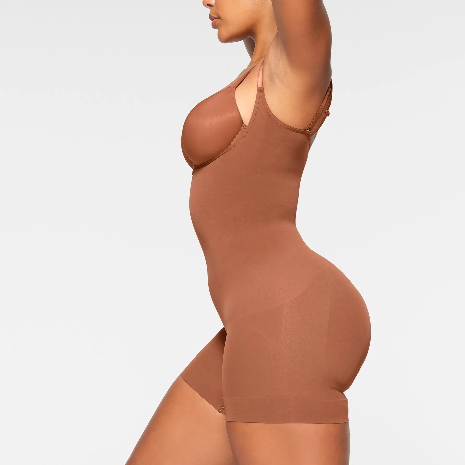 SEAMLESS SCULPT OPEN BUST SHORTIE BODYSUIT | BRONZE