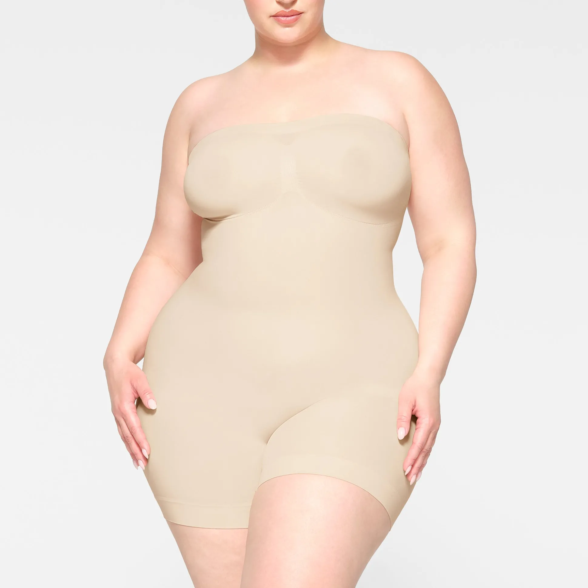 SEAMLESS SCULPT STRAPLESS SHORTIE BODYSUIT | SAND