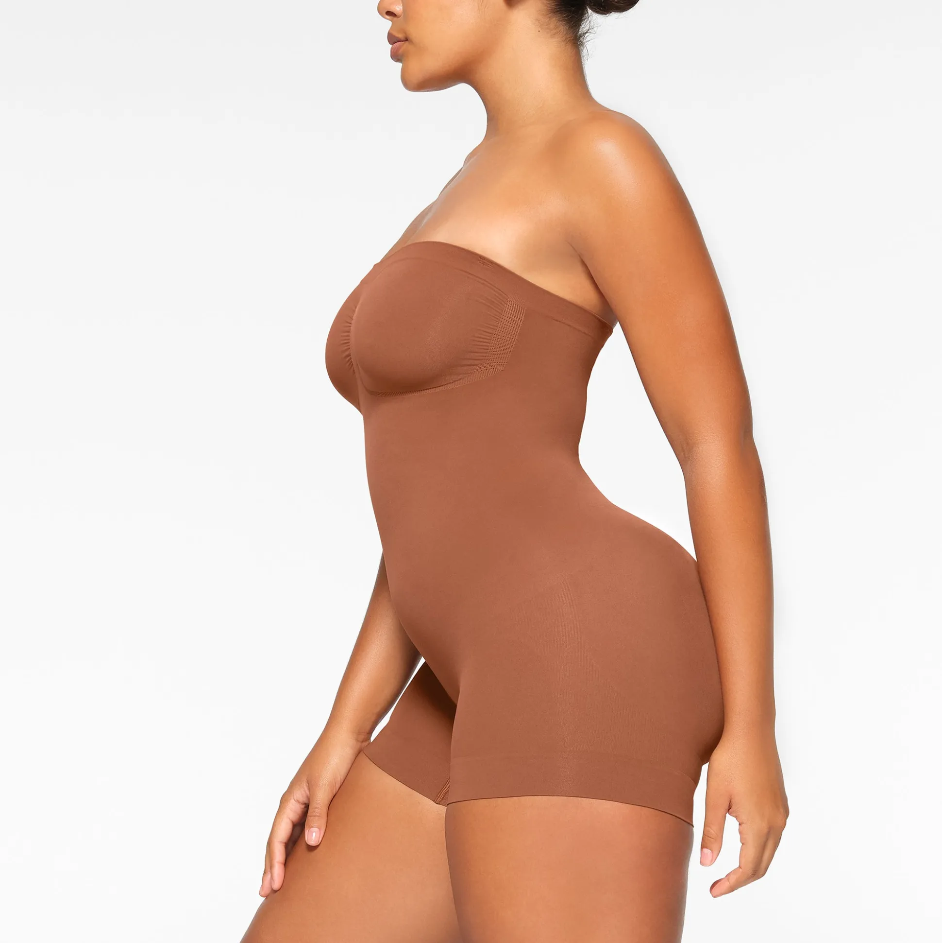 SEAMLESS SCULPT STRAPLESS SHORTIE BODYSUIT | BRONZE