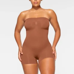SEAMLESS SCULPT STRAPLESS SHORTIE BODYSUIT | BRONZE